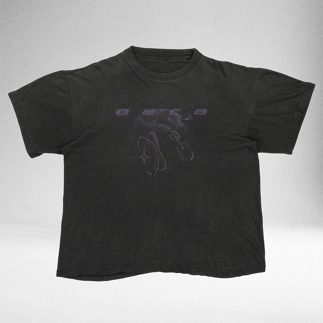 Black t-shirt with a purple graphic design on a light gray background